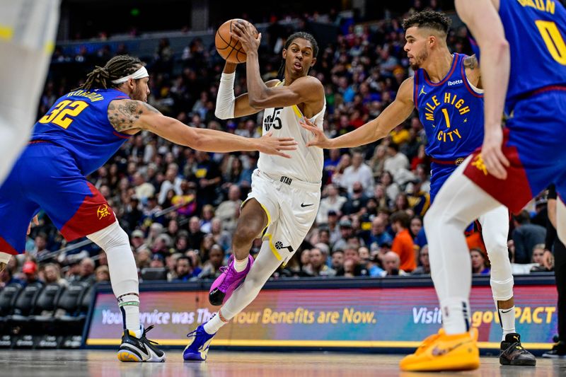 DENVER, COLORADO - NOVEMBER 02: Cody Williams #5 of the Utah Jazz is defended by Michael Porter Jr. #1 and Aaron Gordon #32 of the Denver Nuggets in the second half at Ball Arena on November 2, 2024, 2024 in Denver, Colorado. NOTE TO USER: User expressly acknowledges and agrees that, by downloading and or using this photograph, User is consenting to the terms and conditions of the Getty Images License Agreement. (Photo by Dustin Bradford/Getty Images)