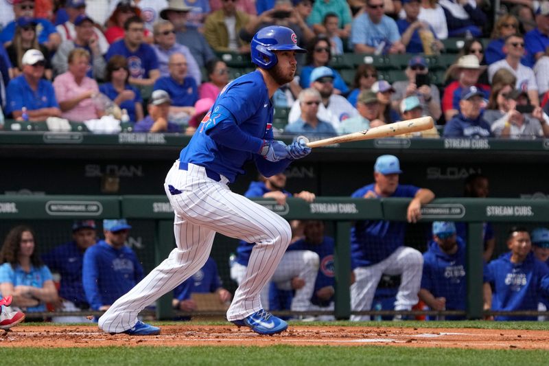 Mar 6, 2024; Mesa, Arizona, USA; Chicago Cubs center fielder Cody Bellinger (24) hits against the Los Angeles Angels in the first inning at Sloan Park. Mandatory Credit: Rick Scuteri-USA TODAY Sports