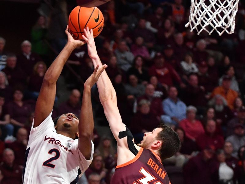 Feb 19, 2024; Blacksburg, Virginia, USA; Virginia Cavaliers guard Reece Beekman (2) shoots as Virginia Tech Hokies forward Robbie Beran (31) during the first half at Cassell Coliseum. Mandatory Credit: Brian Bishop-USA TODAY Sports