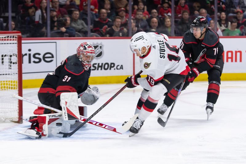 Mar 17, 2024; Ottawa, Ontario, CAN; Ottawa Senators center Tim Stutzle (18) shoots on  Carolina Hurricanes goalie Frederik Andersen (31) in the first period at the Canadian Tire Centre. Mandatory Credit: Marc DesRosiers-USA TODAY Sports