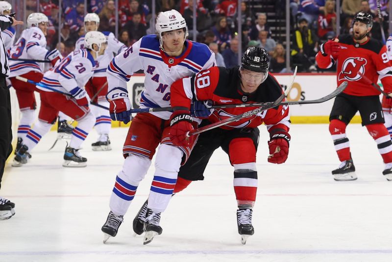 Apr 5, 2025; Newark, New Jersey, USA; New York Rangers left wing Brett Berard (65) and New Jersey Devils left wing Ondrej Palat (18) battle during the first period at Prudential Center. Mandatory Credit: Ed Mulholland-Imagn Images