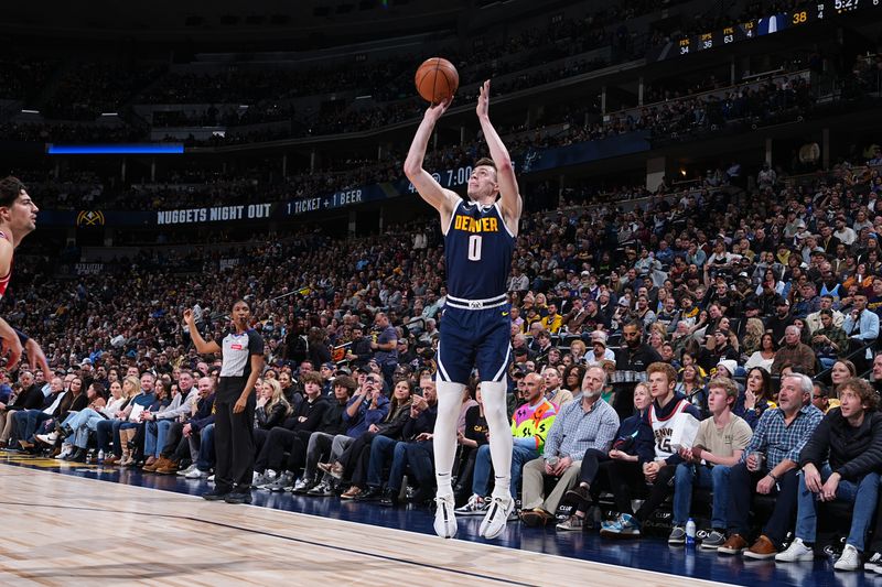 DENVER, CO - FEBRUARY 22: Christian Braun #0 of the Denver Nuggets shoots the ball during the game against the Denver Nuggets on February 22, 2024 at the Ball Arena in Denver, Colorado. NOTE TO USER: User expressly acknowledges and agrees that, by downloading and/or using this Photograph, user is consenting to the terms and conditions of the Getty Images License Agreement. Mandatory Copyright Notice: Copyright 2024 NBAE (Photo by Garrett Ellwood/NBAE via Getty Images)