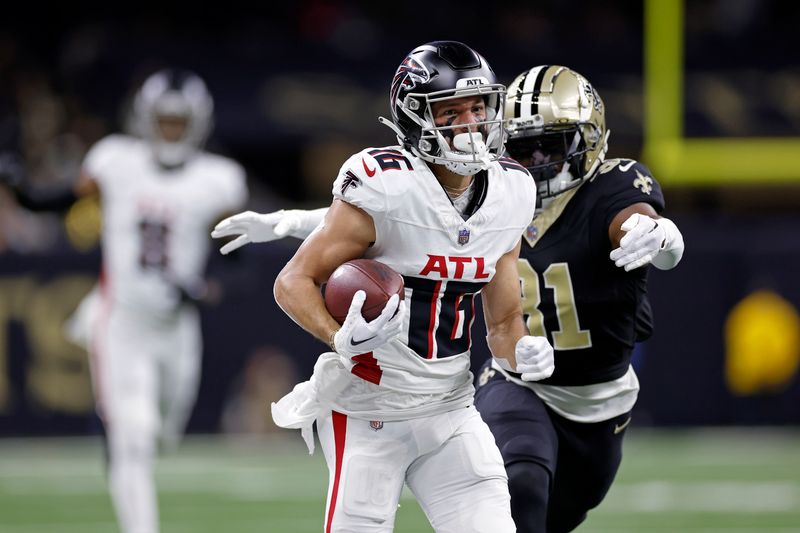 Atlanta Falcons wide receiver Scott Miller (16) runs the ball past New Orleans Saints safety Jordan Howden (31) during an NFL football game, Sunday, Jan. 7, 2024, in New Orleans. (AP Photo/Tyler Kaufman)