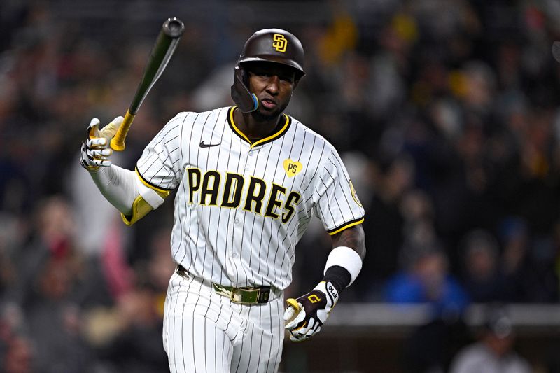 May 13, 2024; San Diego, California, USA; San Diego Padres left fielder Jurickson Profar (10) tosses his bat after hitting a two-run home run against the Colorado Rockies during the sixth inning at Petco Park. Mandatory Credit: Orlando Ramirez-USA TODAY Sports