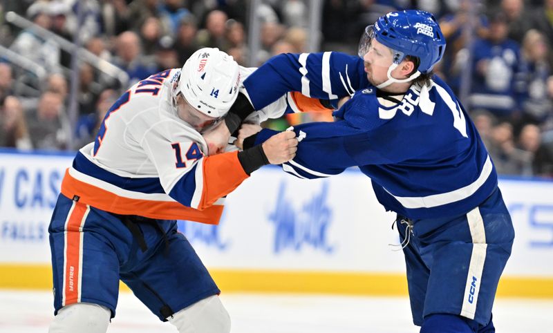 Feb 5, 2024; Toronto, Ontario, CAN;   New York Islanders forward Bo Horvat (14) fights with Toronto Maple Leafs defenseman Simon Benoit (2) in the second period at Scotiabank Arena. Mandatory Credit: Dan Hamilton-USA TODAY Sports