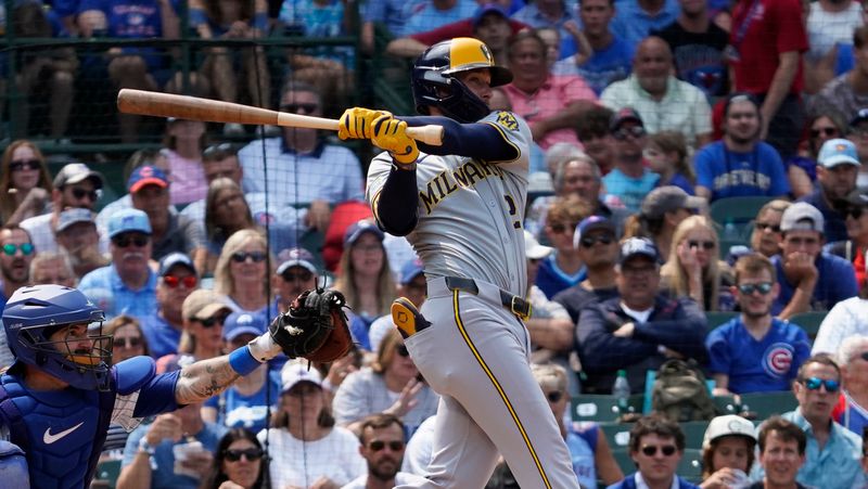 Jul 24, 2024; Chicago, Illinois, USA; Milwaukee Brewers second baseman Brice Turang (2) hits a one run single against the Chicago Cubs during the sixth inning at Wrigley Field. Mandatory Credit: David Banks-USA TODAY Sports