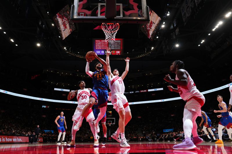 TORONTO, CANADA - OCTOBER 28: Jamal Murray #27 of the Denver Nuggets drives to the basket during the game against the Toronto Raptors on October 28, 2024 at the Scotiabank Arena in Toronto, Ontario, Canada.  NOTE TO USER: User expressly acknowledges and agrees that, by downloading and or using this Photograph, user is consenting to the terms and conditions of the Getty Images License Agreement.  Mandatory Copyright Notice: Copyright 2024 NBAE (Photo by Mark Blinch/NBAE via Getty Images)