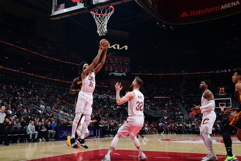 ATLANTA, GA - JANUARY 20: Jarrett Allen #31 of the Cleveland Cavaliers grabs a rebound during the game against the Atlanta Hawks on January 20, 2024 at State Farm Arena in Atlanta, Georgia.  NOTE TO USER: User expressly acknowledges and agrees that, by downloading and/or using this Photograph, user is consenting to the terms and conditions of the Getty Images License Agreement. Mandatory Copyright Notice: Copyright 2024 NBAE (Photo by Scott Cunningham/NBAE via Getty Images)