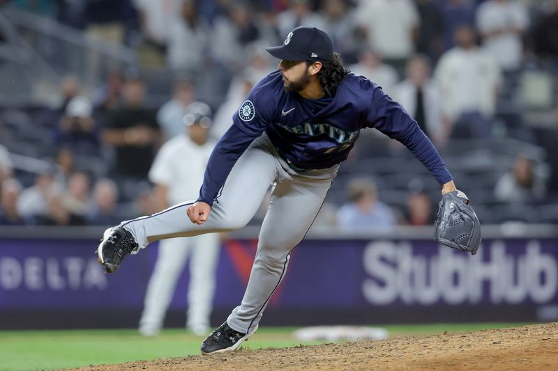 May 20, 2024; Bronx, New York, USA; Seattle Mariners relief pitcher Andres Munoz (75) follows through on a pitch against the New York Yankees during the ninth inning at Yankee Stadium. Mandatory Credit: Brad Penner-USA TODAY Sports