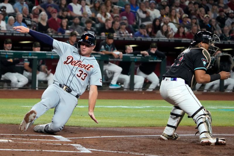 May 17, 2024; Phoenix, Arizona, USA; Detroit Tigers second base Colt Keith (33) scores a run against the Arizona Diamondbacks in the second inning at Chase Field. Mandatory Credit: Rick Scuteri-USA TODAY Sports