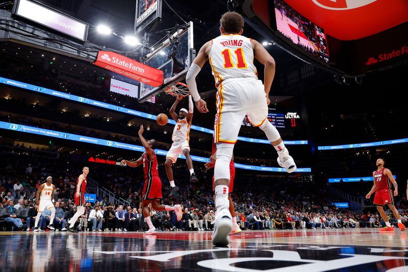 ATLANTA, GEORGIA - FEBRUARY 24: Caris LeVert #3 of the Atlanta Hawks dunks during the fourth quarter against the Miami Heat at State Farm Arena on February 24, 2025 in Atlanta, Georgia. NOTE TO USER: User expressly acknowledges and agrees that, by downloading and or using this photograph, User is consenting to the terms and conditions of the Getty Images License Agreement. (Photo by Todd Kirkland/Getty Images)