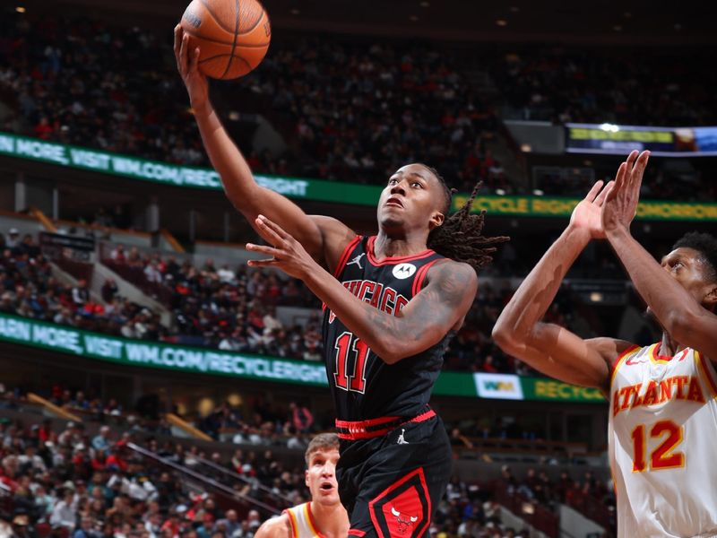 CHICAGO, IL - NOVEMBER 22: Ayo Dosunmu #11 of the Chicago Bulls drives to the basket during the game against the Atlanta Hawks during the Emirates NBA Cup game on November 22, 2024 at United Center in Chicago, Illinois. NOTE TO USER: User expressly acknowledges and agrees that, by downloading and or using this photograph, User is consenting to the terms and conditions of the Getty Images License Agreement. Mandatory Copyright Notice: Copyright 2024 NBAE (Photo by Jeff Haynes/NBAE via Getty Images)