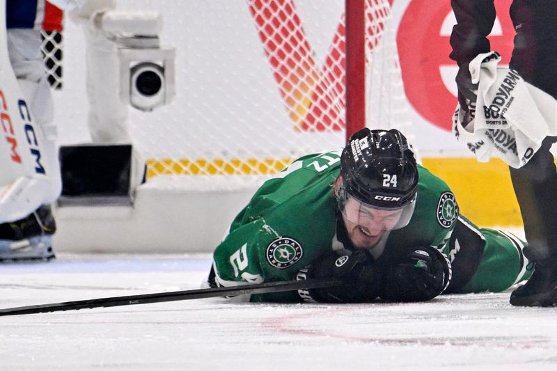 May 23, 2025; Dallas, Texas, USA; Dallas Stars center Roope Hintz (24) reacts after being injured against the Edmonton Oilers in the third period for game two of the Western Conference Final of the 2025 Stanley Cup Playoffs at American Airlines Center. Mandatory Credit: Jerome Miron-Imagn Images