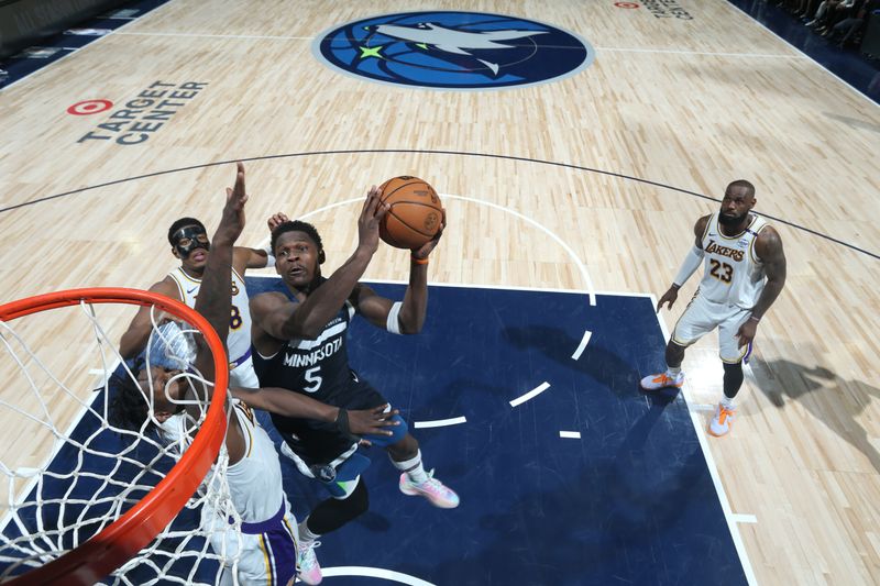 MINNEAPOLIS, MN -  APRIL  27: Anthony Edwards #5 of the Minnesota Timberwolves drives to the basket during the game against the Los Angeles Lakers during Round 1 Game 4 of the 2025 NBA Playoffs  on April 27, 2025 at Target Center in Minneapolis, Minnesota. NOTE TO USER: User expressly acknowledges and agrees that, by downloading and or using this Photograph, user is consenting to the terms and conditions of the Getty Images License Agreement. Mandatory Copyright Notice: Copyright 2025 NBAE (Photo by David Sherman/NBAE via Getty Images)