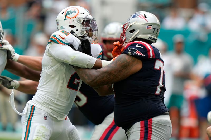 Miami Dolphins linebacker Bradley Chubb (2) defends New England Patriots offensive tackle Trent Brown during the second half of an NFL football game, Sunday, Oct. 29, 2023, in Miami Gardens, Fla. (AP Photo/Lynne Sladky)