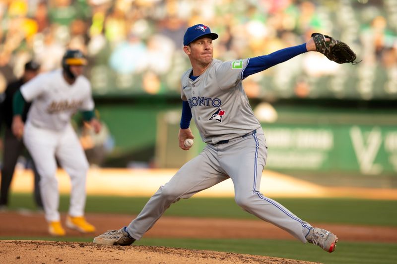 Jun 7, 2024; Oakland, California, USA; Toronto Blue Jays starting pitcher Chris Bassitt (40) delivers a pitch against the Oakland Athletics during the second inning at Oakland-Alameda County Coliseum. Mandatory Credit: D. Ross Cameron-USA TODAY Sports