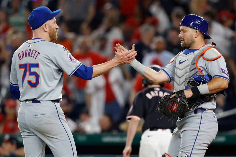 Jun 4, 2024; Washington, District of Columbia, USA; New York Mets pitcher Reed Garrett (75) celebrates with Mets catcher Tomás Nido (3) after their game against the Washington Nationals at Nationals Park. Mandatory Credit: Geoff Burke-USA TODAY Sports