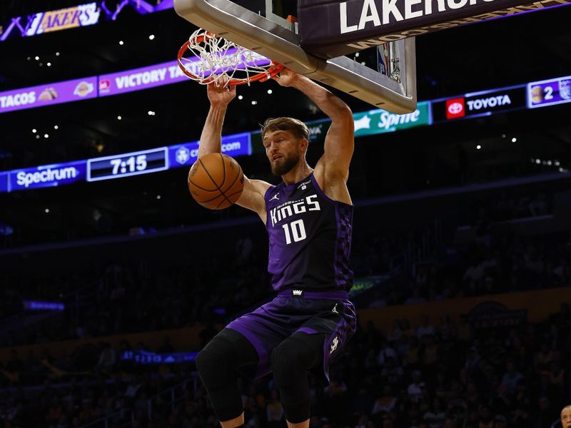 LOS ANGELES, CALIFORNIA - NOVEMBER 15:  Domantas Sabonis #10 of the Sacramento Kings makes the slam dunk against the Los Angeles Lakers in the first quarter at Crypto.com Arena on November 15, 2023 in Los Angeles, California.  NOTE TO USER: User expressly acknowledges and agrees that, by downloading and/or using this photograph, user is consenting to the terms and conditions of the Getty Images License Agreement. (Photo by Ronald Martinez/Getty Images)