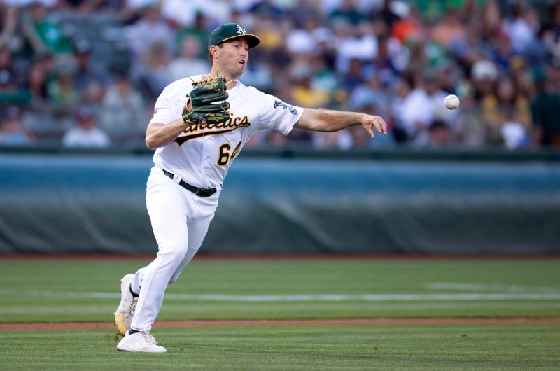 Aug 19, 2023; Oakland, California, USA; Oakland Athletics starting pitcher Ken Waldichuk (64) throws to first base in time for the out during the second inning at Oakland-Alameda County Coliseum. Mandatory Credit: D. Ross Cameron-USA TODAY Sports