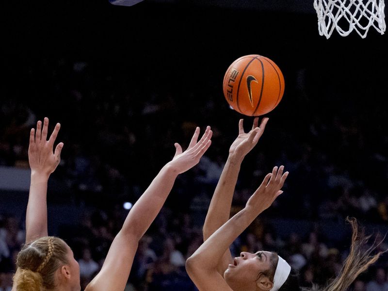 Jan 11, 2024; Baton Rouge, Louisiana, USA; LSU Lady Tigers forward Angel Reese (10) shoots against Texas A&M Aggies forward Lauren Ware (32) during the second half at Pete Maravich Assembly Center. Mandatory Credit: Matthew Hinton-USA TODAY Sports