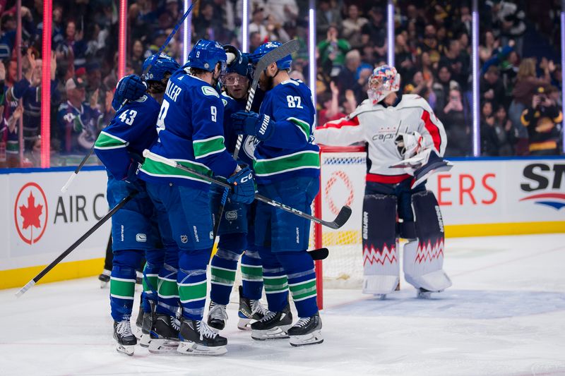 Mar 16, 2024; Vancouver, British Columbia, CAN; Vancouver Canucks defenseman Quinn Hughes (43) and forward Ilya Mikheyev (65) and forward Brock Boeser (6) and forward J.T. Miller (9) and defenseman Ian Cole (82) celebrate Boeser’s goal scored on Washington Capitals goalie Charlie Lindgren (79) in the first period at Rogers Arena. Mandatory Credit: Bob Frid-USA TODAY Sports