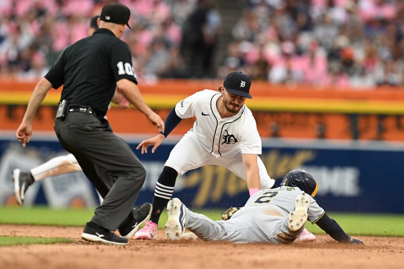 Jun 8, 2024; Detroit, Michigan, USA;  Milwaukee Brewers second baseman Brice Turang (2) steals second base ahead of the tag from Detroit Tigers second baseman Zach McKinstry (39) in the fifth inning at Comerica Park. Mandatory Credit: Lon Horwedel-USA TODAY Sports