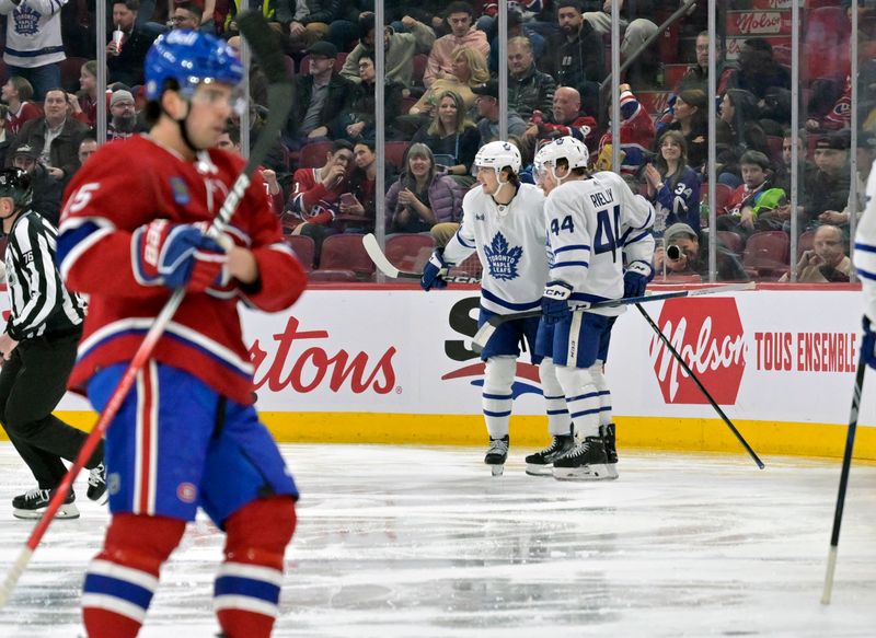 Mar 9, 2024; Montreal, Quebec, CAN; Toronto Maple Leafs forward Bobby McMann (74) celebrates with teammates after scoring a goal against the Montreal Canadiens during the second period at the Bell Centre. Mandatory Credit: Eric Bolte-USA TODAY Sports