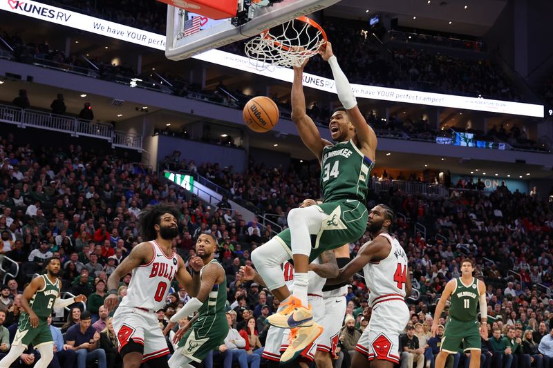 MILWAUKEE, WISCONSIN - DECEMBER 11: Giannis Antetokounmpo #34 of the Milwaukee Bucks dunks against the Chicago Bulls during a game at Fiserv Forum on December 11, 2023 in Milwaukee, Wisconsin. NOTE TO USER: User expressly acknowledges and agrees that, by downloading and or using this photograph, User is consenting to the terms and conditions of the Getty Images License Agreement. (Photo by Stacy Revere/Getty Images)