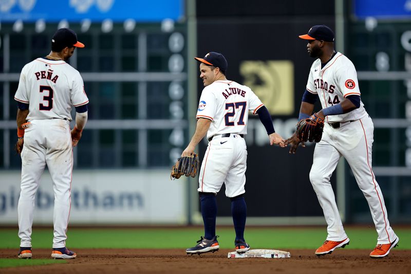 Jul 31, 2024; Houston, Texas, USA; (from L-to-R) Houston Astros shortstop Jeremy Peña (3), second baseman Jose Altuve (27) and left fielder Yordan Alvarez (44) congratulate each other following the final out against the Pittsburgh Pirates during the ninth inning at Minute Maid Park. Mandatory Credit: Erik Williams-USA TODAY Sports