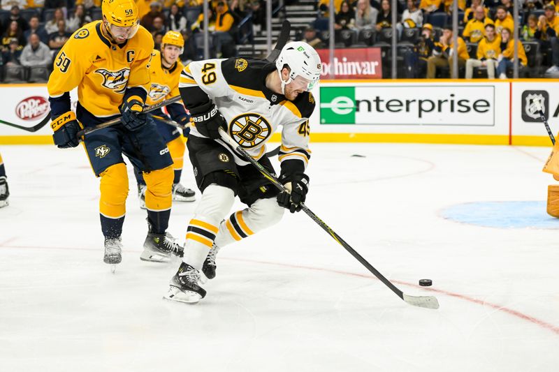 Oct 22, 2024; Nashville, Tennessee, USA; Boston Bruins left wing Max Jones (49) skates with the puck against the Nashville Predators during the second period at Bridgestone Arena. Mandatory Credit: Steve Roberts-Imagn Images