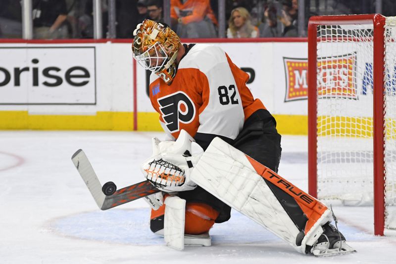 Mar 4, 2025; Philadelphia, Pennsylvania, USA; Philadelphia Flyers goaltender Ivan Fedotov (82) makes a save against the Calgary Flames during the second period at Wells Fargo Center. Mandatory Credit: Eric Hartline-Imagn Images