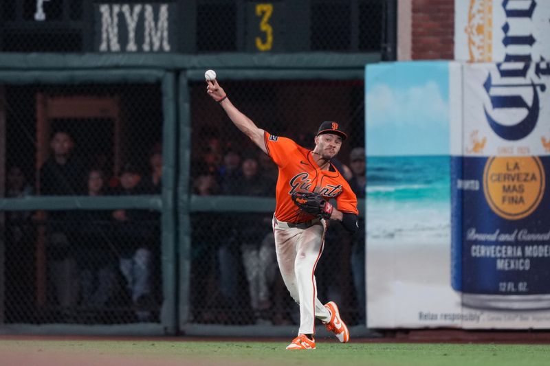 Sep 12, 2025; San Francisco, California, USA; San Francisco Giants outfielder Grant McCray (58) throws out Los Angeles Dodgers catcher Ben Rortvedt (not shown) at third base during the tenth inning at Oracle Park. Mandatory Credit: Darren Yamashita-Imagn Images