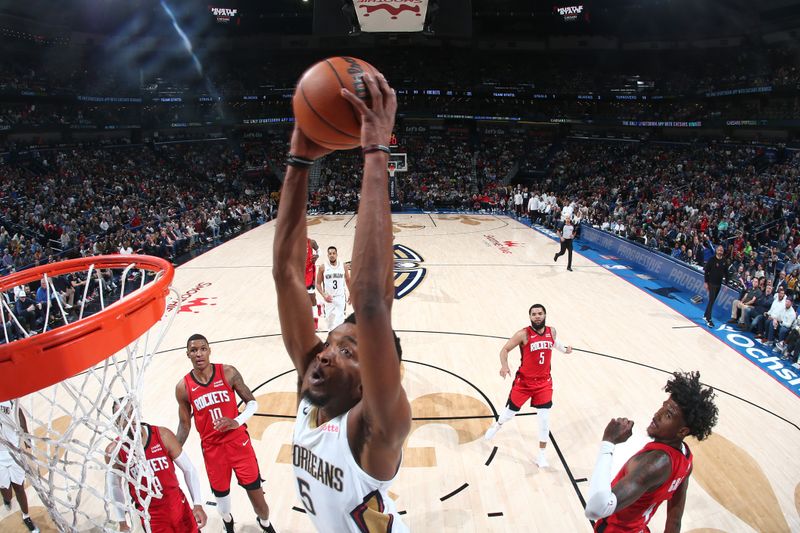 NEW ORLEANS, LA - FEBRUARY 22: Herb Jones #5 of the New Orleans Pelicans dunks the ball during the game Houston Rockets on February 22, 2024 at the Smoothie King Center in New Orleans, Louisiana. NOTE TO USER: User expressly acknowledges and agrees that, by downloading and or using this Photograph, user is consenting to the terms and conditions of the Getty Images License Agreement. Mandatory Copyright Notice: Copyright 2024 NBAE (Photo by Layne Murdoch Jr./NBAE via Getty Images)