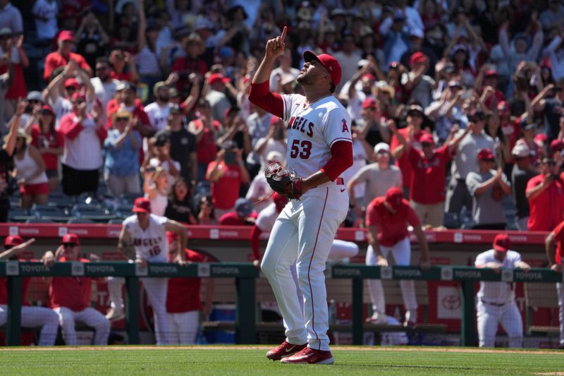 Jul 2, 2023; Anaheim, California, USA; Los Angeles Angels relief pitcher Carlos Estevez (53) celebrates at the end of the game against the Arizona Diamondbacks at Angel Stadium. Mandatory Credit: Kirby Lee-USA TODAY Sports