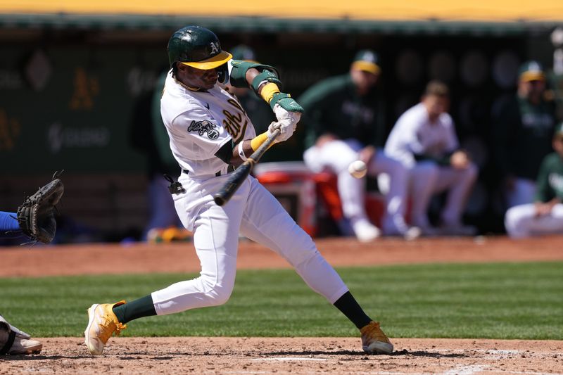 Apr 16, 2023; Oakland, California, USA; Oakland Athletics center fielder Esteury Ruiz (1) hits an RBI single against the New York Mets during the fifth inning at RingCentral Coliseum. Mandatory Credit: Darren Yamashita-USA TODAY Sports