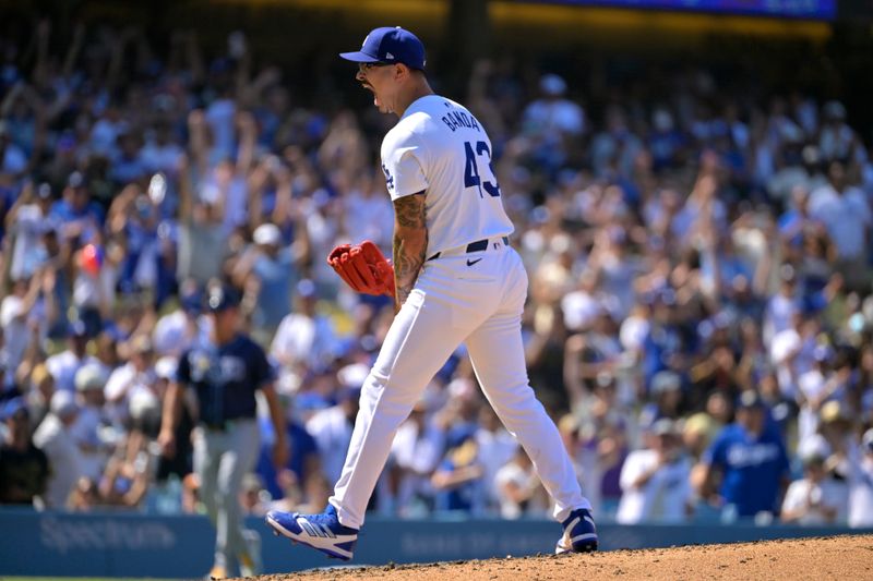 Aug 25, 2024; Los Angeles, California, USA;  Los Angeles Dodgers relief pitcher Anthony Banda (43) reacts after earning a save in the ninth inning against the Tampa Bay Rays at Dodger Stadium. Mandatory Credit: Jayne Kamin-Oncea-USA TODAY Sports