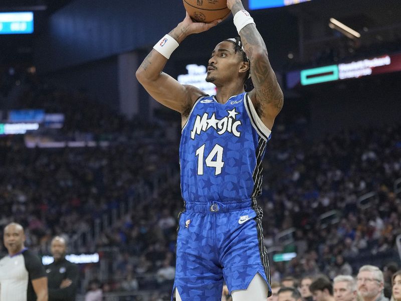 SAN FRANCISCO, CALIFORNIA - JANUARY 02: Gary Harris #14 of the Orlando Magic shoots a three-point shot against the Golden State Warriors during the first quarter of an NBA basketball game at Chase Center on January 02, 2024 in San Francisco, California. NOTE TO USER: User expressly acknowledges and agrees that, by downloading and or using this photograph, User is consenting to the terms and conditions of the Getty Images License Agreement. (Photo by Thearon W. Henderson/Getty Images)