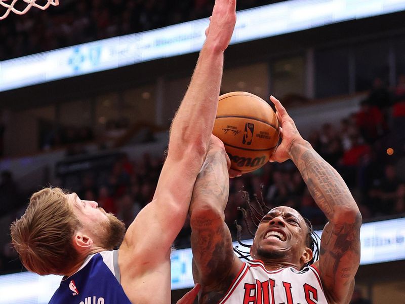 CHICAGO, ILLINOIS - FEBRUARY 03: DeMar DeRozan #11 of the Chicago Bulls shoots over Domantas Sabonis #10 of the Sacramento Kings during the second half at the United Center on February 03, 2024 in Chicago, Illinois. NOTE TO USER: User expressly acknowledges and agrees that, by downloading and or using this photograph, User is consenting to the terms and conditions of the Getty Images License Agreement.  (Photo by Michael Reaves/Getty Images)