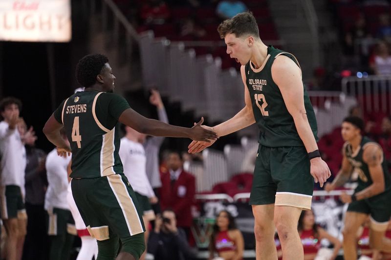 Feb 3, 2024; Fresno, California, USA; Colorado State Rams forward Patrick Cartier (12) is congratulated by guard Isaiah Stevens (4) after making a three point basket against the Fresno State Bulldogs in the second half at the Save Mart Center. Mandatory Credit: Cary Edmondson-USA TODAY Sports