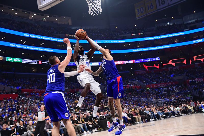 LOS ANGELES, CA - APRIL 21:  Tim Hardaway Jr. #10 of the Dallas Mavericks drives to the basket during the game against the LA Clippers during Round 1 Game 1 of the 2024 NBA Playoffs on April 21, 2024 at Crypto.Com Arena in Los Angeles, California. NOTE TO USER: User expressly acknowledges and agrees that, by downloading and/or using this Photograph, user is consenting to the terms and conditions of the Getty Images License Agreement. Mandatory Copyright Notice: Copyright 2024 NBAE (Photo by Adam Pantozzi/NBAE via Getty Images)