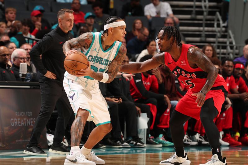 CHARLOTTE, NC - OCTOBER 30: Tre Mann #23 of the Charlotte Hornets handles the ball during the game against the Toronto Raptors on October 30, 2024 at Spectrum Center in Charlotte, North Carolina. NOTE TO USER: User expressly acknowledges and agrees that, by downloading and or using this photograph, User is consenting to the terms and conditions of the Getty Images License Agreement. Mandatory Copyright Notice: Copyright 2024 NBAE (Photo by Kent Smith/NBAE via Getty Images)