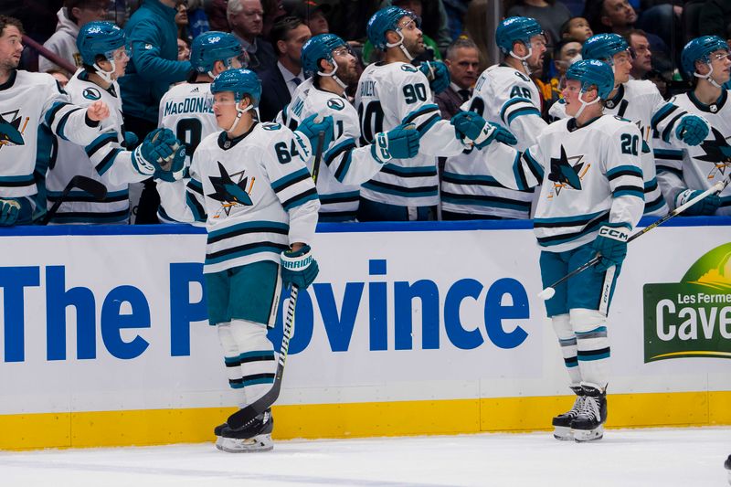 Dec 23, 2023; Vancouver, British Columbia, CAN; San Jose Sharks forward Mikael Granlund (64) and forward Fabian Zetterlund (20) celebrate Granlund   s goal against the Vancouver Canucks in the first period at Rogers Arena. Mandatory Credit: Bob Frid-USA TODAY Sports