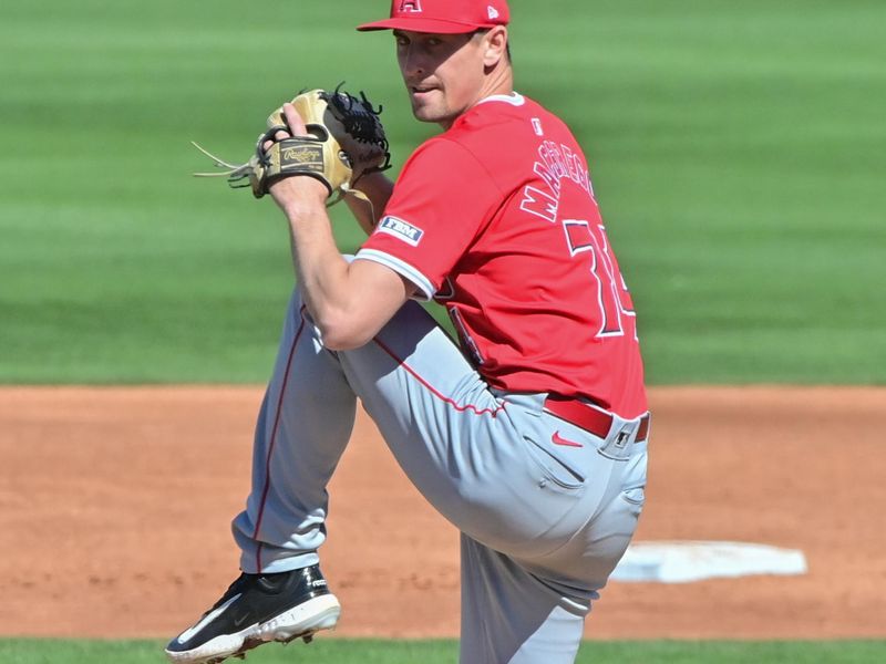 Mar 1, 2024; Peoria, Arizona, USA; Los Angeles Angels pitcher Travis MacGregor (74) throws in the second inning against the San Diego Padres during a spring training game at Peoria Sports Complex. Mandatory Credit: Matt Kartozian-USA TODAY Sports