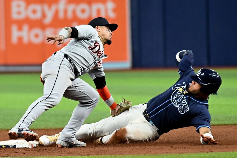 Apr 23, 2024; St. Petersburg, Florida, USA; Detroit Tigers shortstop Javier Baez (28) tags out Tampa Bay Rays designated hitter Harold Ramirez (43) in the sixth inning at Tropicana Field. Mandatory Credit: Jonathan Dyer-USA TODAY Sports