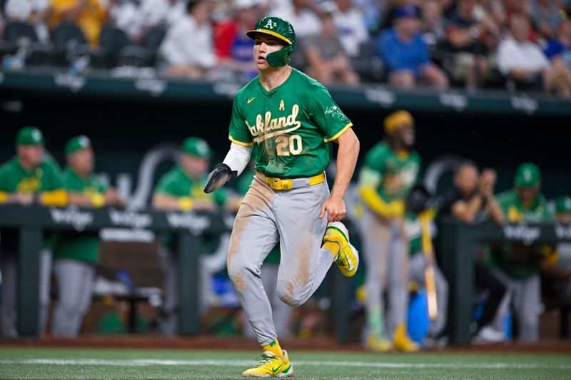 Sep 1, 2024; Arlington, Texas, USA; Oakland Athletics second baseman Zack Gelof (20) scores the tying run against the Texas Rangers during the eighth inning at Globe Life Field. Mandatory Credit: Jerome Miron-USA TODAY Sports