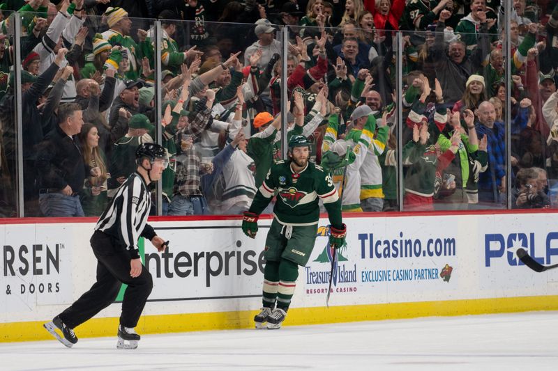 Feb 21, 2023; Saint Paul, Minnesota, USA; Minnesota Wild right wing Ryan Hartman (38) scores against the Los Angeles Kings in the third period at Xcel Energy Center. Mandatory Credit: Matt Blewett-USA TODAY Sports