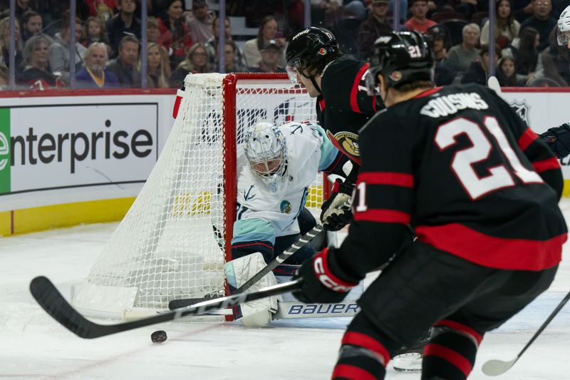 Nov 2, 2024; Ottawa, Ontario, CAN; Seattle Kraken goaltender Philipp Grubauer (31) makes a save in front of Ottawa Senators right wing Zack MacEwen (17) in the first period at the Canadian Tire Centre. Mandatory Credit: Marc DesRosiers-Imagn Images