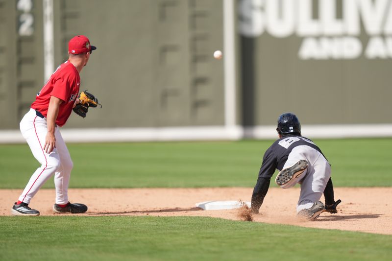 Mar 4, 2026; Fort Myers, Florida, USA;  New York Yankees shortstop Braden Shewmake (89) gets out of a run-down as Boston Red Sox infielder Caden Rose (51) watches the ball sail into center field in the eighth inning at JetBlue Park at Fenway South. Mandatory Credit: Jim Rassol-Imagn Images