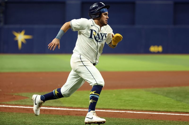 Sep 3, 2024; St. Petersburg, Florida, USA;  Tampa Bay Rays first base Jonathan Aranda (62) runs home to score a run against the Minnesota Twins during the fourth inning  at Tropicana Field. Mandatory Credit: Kim Klement Neitzel-Imagn Images