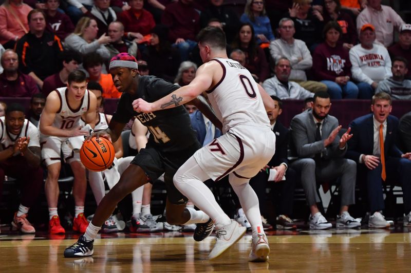 Jan 27, 2024; Blacksburg, Virginia, USA; Georgia Tech Yellow Jackets guard Kowacie Reeves Jr. (14) drives the baseline while being defended by Virginia Tech Hokies guard Hunter Cattoor (0) during the first half at Cassell Coliseum. Mandatory Credit: Brian Bishop-USA TODAY Sports